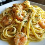 Close-up of rich Creamy Lemon Garlic Shrimp Pasta topped with parsley and zest.
