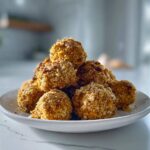 A mound of golden, crunchy Air Fryer Ranch Chickpeas piled high on a white plate.