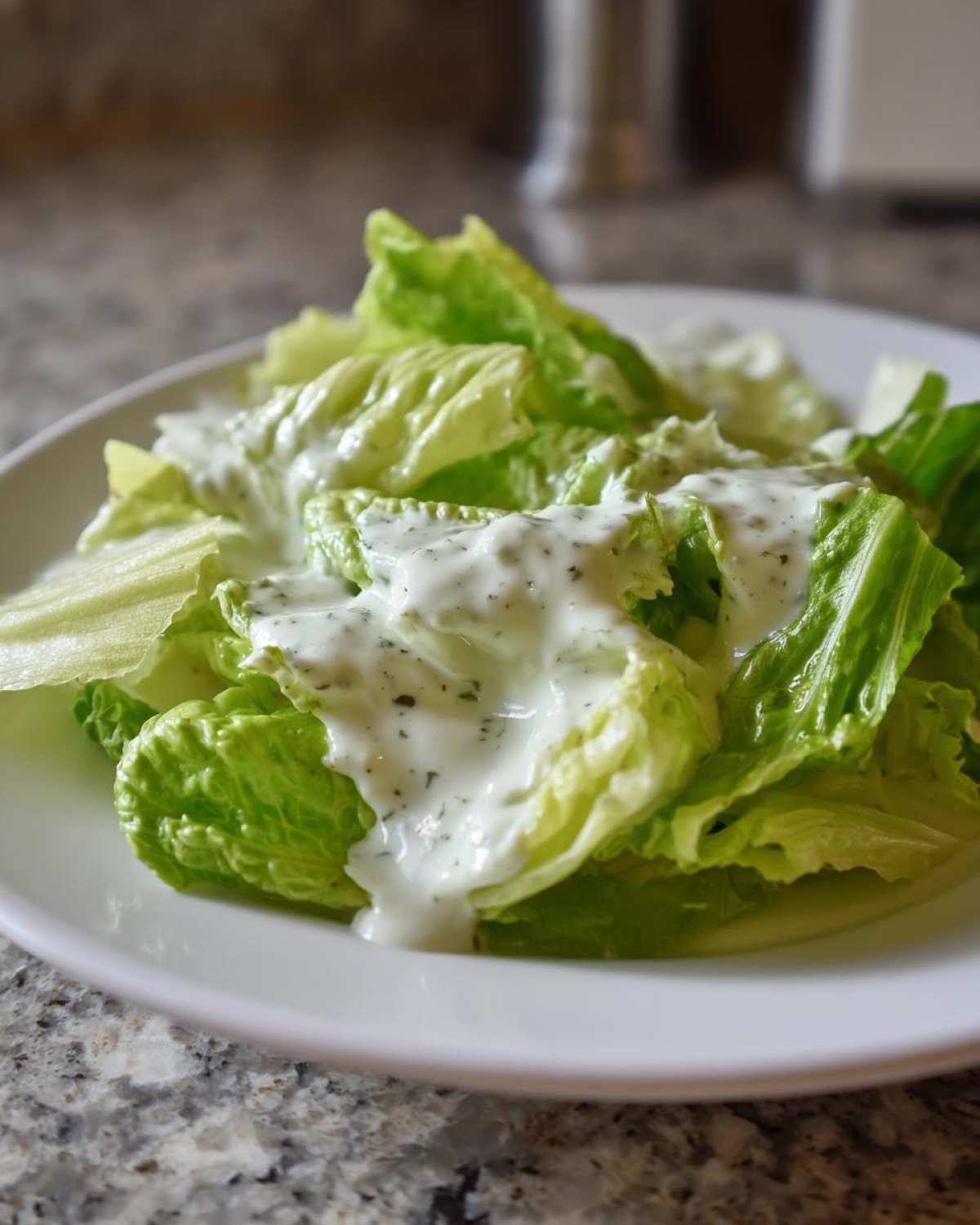 Fresh romaine lettuce topped generously with creamy Copycat Olive Garden Salad Dressing.