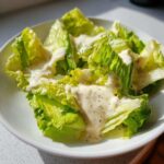 Crisp romaine lettuce leaves generously topped with creamy Copycat Olive Garden Salad Dressing.