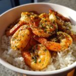 Close-up of Garlic Butter Shrimp Bowl with Rice, featuring plump shrimp coated in garlic butter and herbs over white rice.
