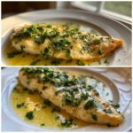 A close-up of a cooked Lemon Garlic Butter Tilapia fillet swimming in buttery sauce and topped with fresh parsley.