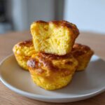 Close-up of three Starbucks Copycat Egg Bites stacked, showing the fluffy, airy interior texture of the top one.